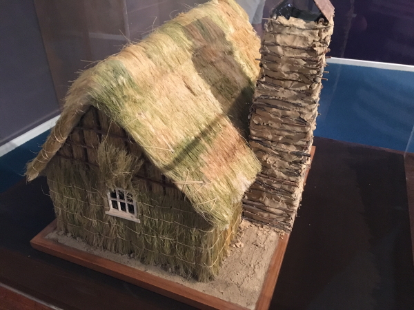 Model of a whare typically built by the early settlers in Petone.